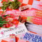Colorful signs with various messages on a checkered background